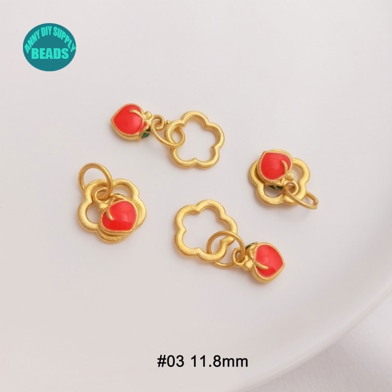May include: Four gold-colored charms with a flower-like design and a red heart-shaped accent. The charms are approximately 0.46 inches in size. The text "#03 11.8mm" is visible at the bottom of the image. The charms are for DIY supply beads.