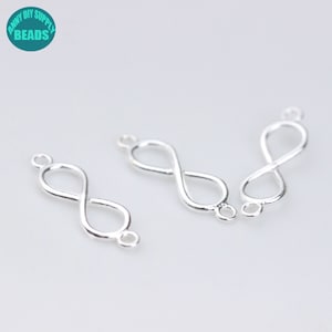 May include: Three silver infinity symbol charms with jump rings. The charms are perfect for jewelry making and crafting.