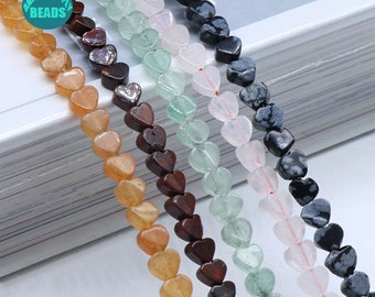 May include: A strand of six different colored heart-shaped beads. The beads are made of natural stone and have a variety of patterns and textures. The beads are strung on a clear elastic cord.