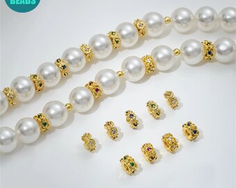 May include: A strand of white pearl beads with gold spacers featuring colorful gemstones. The spacers are also available individually.