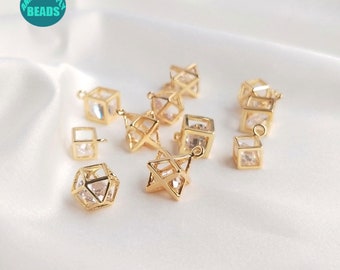 May include: A collection of gold-tone metal charms featuring geometric shapes with clear crystal accents. The charms are perfect for jewelry making and crafting projects.