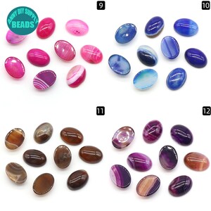 May include: Assortment of 10 oval shaped agate cabochons in pink, blue, brown, and purple colors. The cabochons are approximately 1 inch in length.