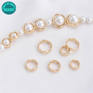 May include: A set of gold-toned metal rings with a wavy edge. The rings are of different sizes and are perfect for jewelry making.