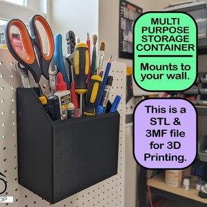 May include: Black multi-purpose storage container mounted on a pegboard, filled with tools like scissors, screwdrivers, and wrenches. The container has text that says "Multi Purpose Storage Container" and "Mounts to your wall."