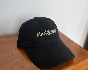Hoed met Man & Heks-logo