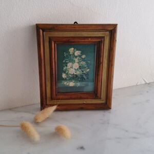 Small vintage flower picture in an old wooden frame, nostalgic, shabby