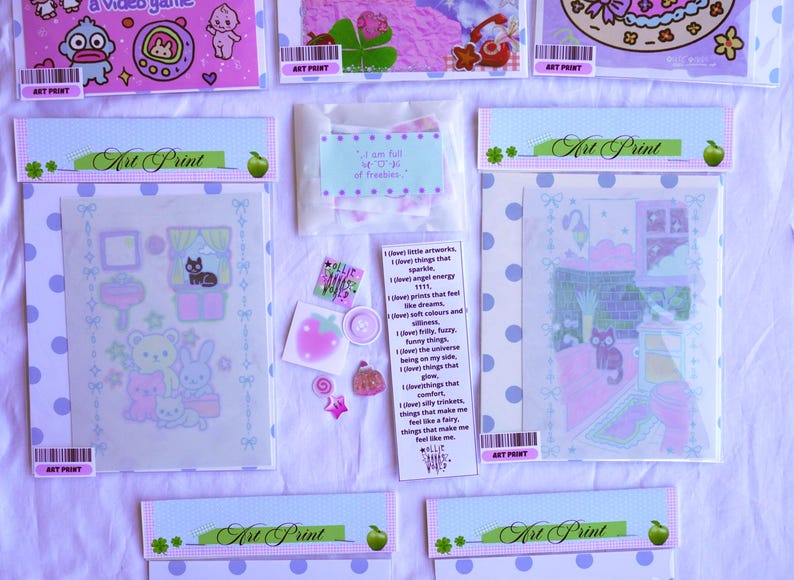 May include: An assortment of art prints and stickers in pastel colors. The prints feature cute illustrations of animals, rooms, and other whimsical designs. Some prints are packaged in clear plastic sleeves with polka dot borders. There is also a small bag of freebies.