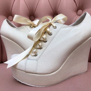 Tennis shoes with platform heels sales