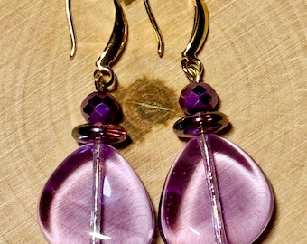 Czech glass earrings in clear purple glass with gold French hooks. Very classy and elegant with a touch of boho. Would make a great gift.