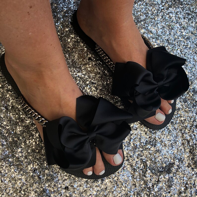 black bow flip flops