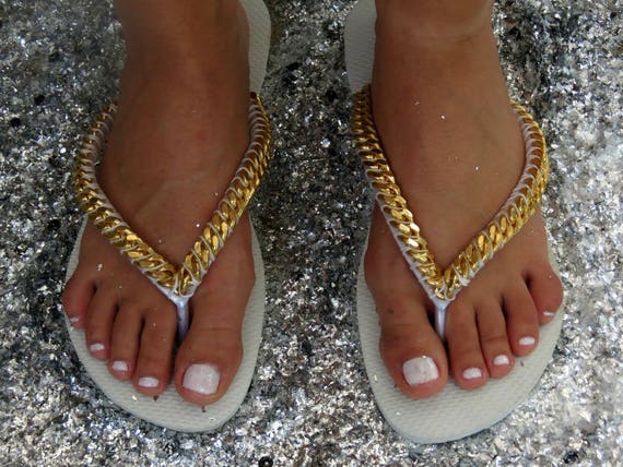Flip flops gold and white best sale