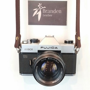 Brown Leather Camera Strap. Single rivet and glued camera strap for your film or digital camera. Variable fixed length design.