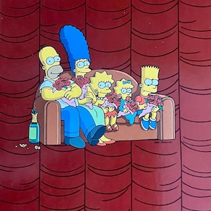 May include: A framed print of the Simpson family, including Homer, Marge, Lisa, Maggie, and Bart, sitting on a brown sofa. Each character holds red roses. The background is a red curtain, and a bottle of champagne is on the floor.