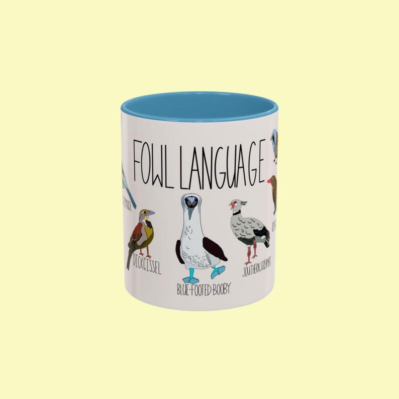 Front view of the 'Fowl Language' coffee mug featuring humorous bird illustrations and puns.