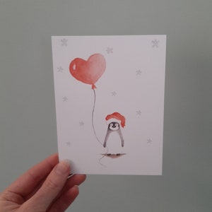 Kerstkaart pinguin met ballon. Fijne feestdagen, prettige kerst
