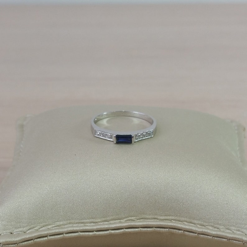 Delicate thin 14 karat gold genuine natural sapphire and diamond gemstone engagement promise ring