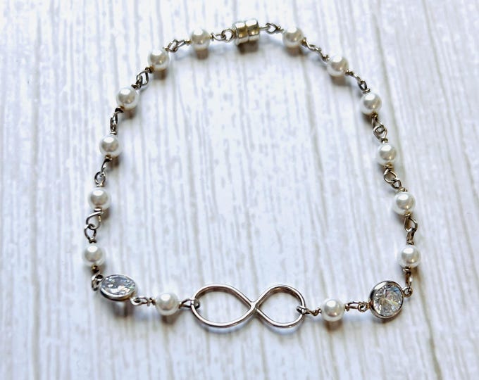 silver bracelet infinity bracelet. Gold pearl bracelet dainty gold bracelet. Infinity symbol magnetic bracelet perfect Christian gift.