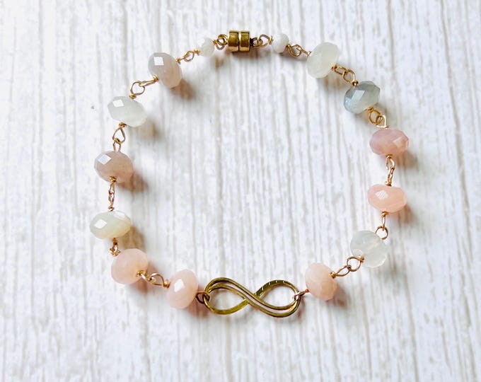 Infinity Bracelet with sunstone beads and mystic milky quartz beads. Infinity charm bracelet the perfect infinity bracelet gift for her