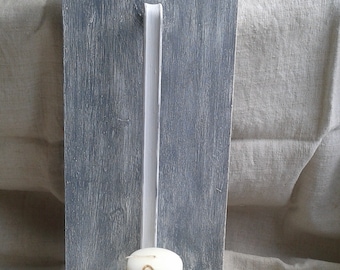 wall candlestick made with an old patinated ladle