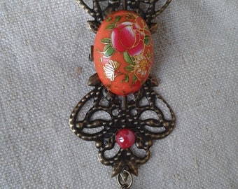 broche "cabochon fleuri orange"