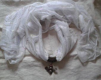 white scarf and its bronze bee charm