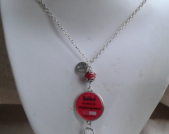 red pregnancy bola necklace "baby being downloaded... please wait"