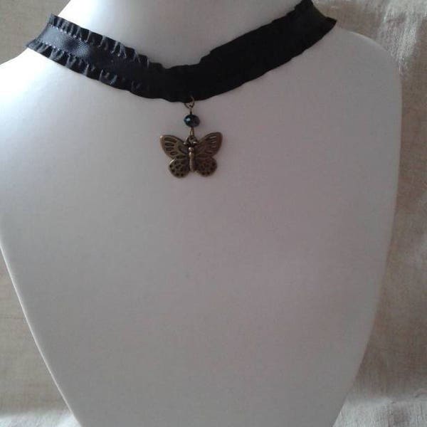 collier ras de cou "ruban noir et papillon bronze"