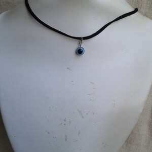necklace flush with neck "evil eye"