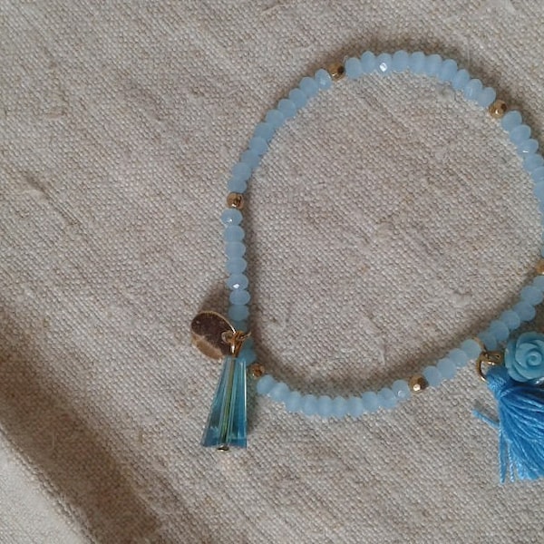 bracelet "perles bleues et pompon"