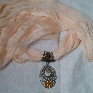 Yellow scarf and bronze print with flower