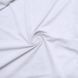 May include: Close-up of white fabric with a spiral pattern. The fabric is tightly woven and appears to be soft. The image is well-lit, highlighting the texture and folds of the material. The fabric is a solid, bright white.