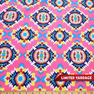 May include: Pink fabric with a repeating pattern of colorful geometric designs. The fabric has a limited yardage available.