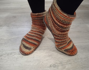 Knitted ugg shoes with felt soles.