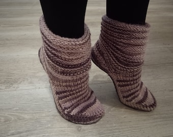 Knitted ugg shoes with felt soles.