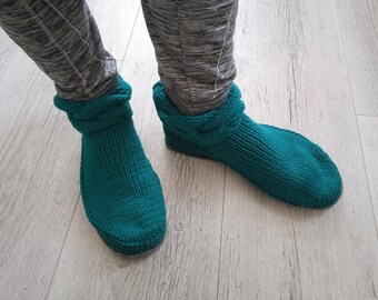 Knitted ugg shoes with felt soles.