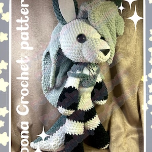 May include: A handmade crochet bunny in shades of white, gray, and black. The bunny has long ears, a striped body, and a scarf. The text "Loona Crochet pattern" and "Pastelpandabum" are visible.