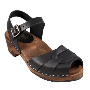 Swedish Clogs in black leather with wooden clogs base. Low heel open toed leather clogs  perfect summer sandals by Lotta from Stockholm.