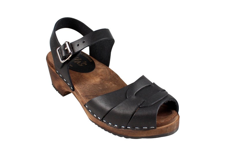 Swedish Clogs in black leather with wooden clogs base. Low heel open toed leather clogs  perfect summer sandals by Lotta from Stockholm.