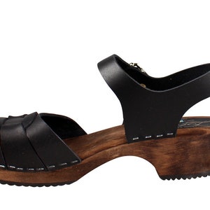 Swedish Clogs in black leather with wooden clogs base. Low heel open toed leather clogs  perfect summer sandals by Lotta from Stockholm.
