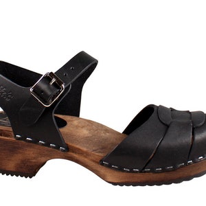 Swedish Clogs in black leather with wooden clogs base. Low heel open toed leather clogs  perfect summer sandals by Lotta from Stockholm.