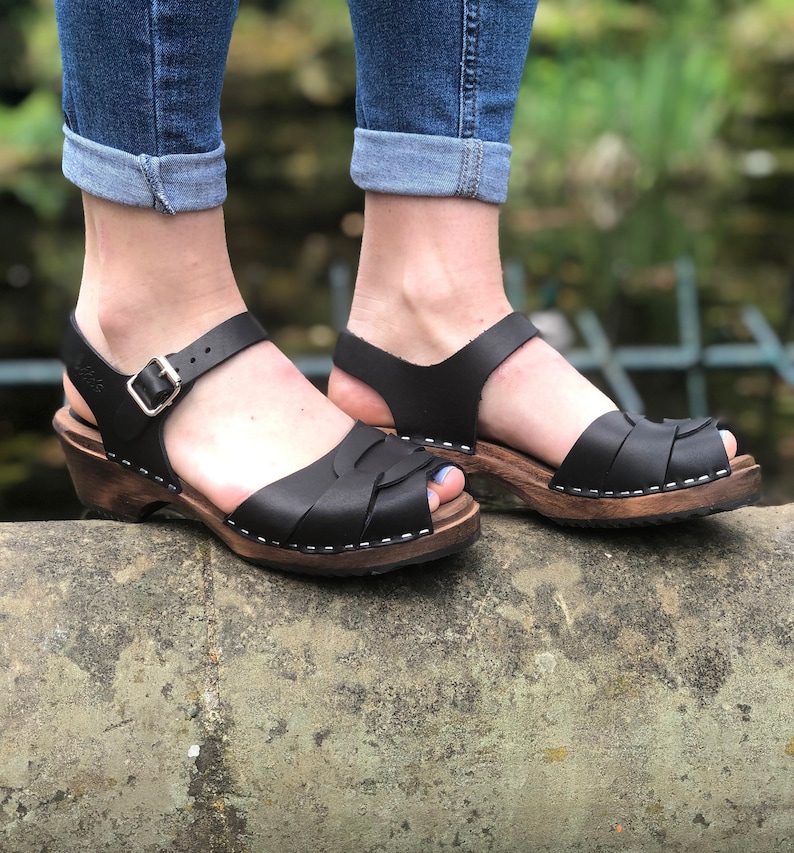 Swedish Clogs in black leather with wooden clogs base. Low heel open toed leather clogs  perfect summer sandals by Lotta from Stockholm.