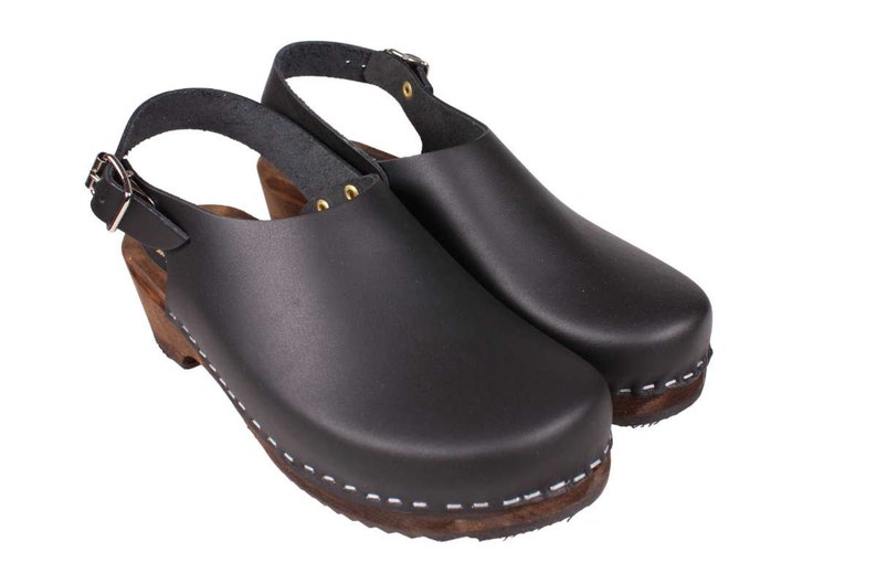 Slingback women's clogs black leather on brown wooden clogs base by Lotta from Stockholm