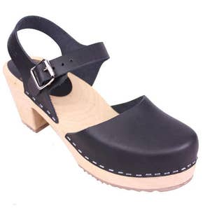 Black leather clogs. Highwood black womens clogs on a natural wooden clogs base.