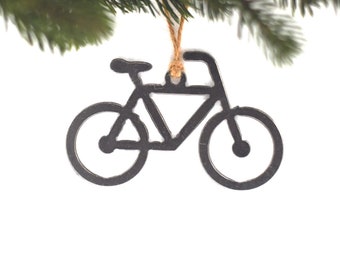 May include: A black metal bicycle ornament with a brown twine hanger.