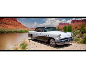 White Buick Impala car on red canyon river shore with red mountain landscape.  Canvas wrap panorama photograph.