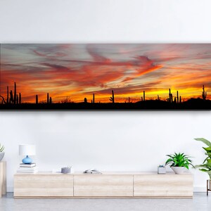 Red and yellow desert sunset among Saguaro cactus in Arizona. Panoramic canvas gallery wrapped art decor photography.