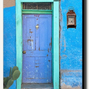 Canvas gallery wrapped photograph of colorful American Southwest building with blue wood door and blue adobe wall. Art decor for living room