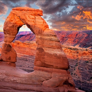 Photograph of  very red Delicate Arch at sunset. Arches National Park, Moab Utah. Red decor landscape fine art photography wall art decor.