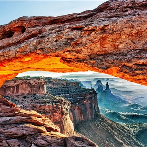 Mesa Arch at sunrise glowing red at the beautiful Canyonlands National Park, Utah. Red arch landscape fine art photography wall art decor.