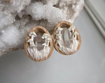 19 mm white mushroom gauges. Crystal plugs with clear quartz inlay
